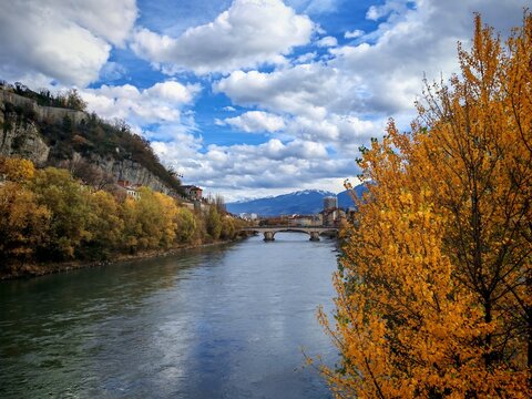 Grenoble, France - November 15, 2025: Bank of Isere river at Grenoble in autumn day. View at Bastilia hill