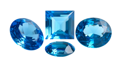 Four polished blue gemstones of varying cuts set against a stark black background