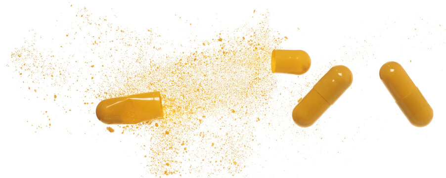 Open medical capsule with powder flying, isolated on white background, clipping path, vitamin b 