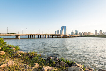 Fototapeta premium Suzhou Modern Bridge and City Skyline Over River