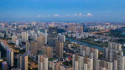 Aerial Suzhou Cityscape with Residential Towers and Waterways © ChuThi