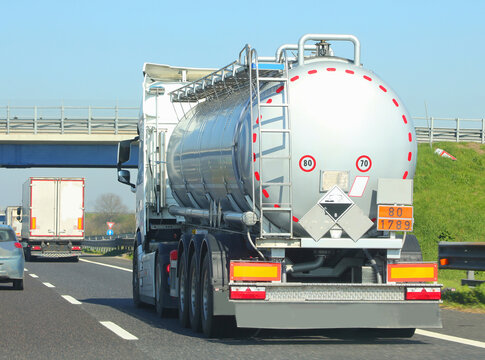 fuel tanker truck speeding on highway to resupply gas stations