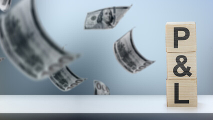 Profit and loss statement, represented on wooden blocks, with money falling in the background. Business, finance, and investment