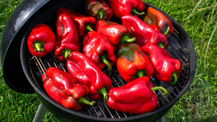 Smoky red peppers sizzle on a grill, celebrating summer fiestas, fiery flavors, and Mediterranean culinary poetry under open skies