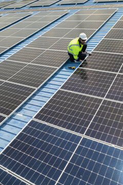 Verticle view of engineers checking on solar panel