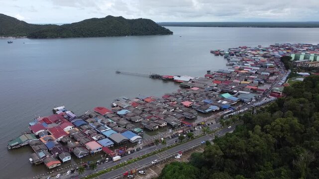 Sandakan, Sabah, Malaysia: Drone view of Kampung Buli Sim Sim, a water village on stilts on the coast of Sandakan reachable by plank walkways, depicts lives of some of the local fishermen village.