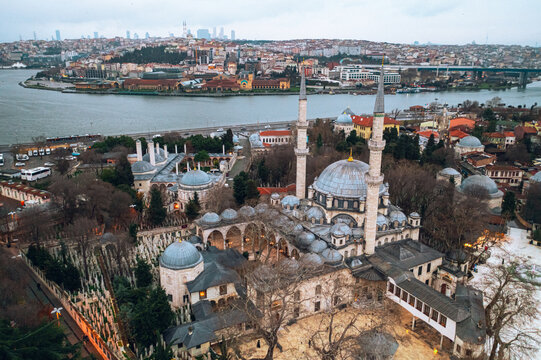 Eyup Sultan Mosque. Aerial view of the mosque taken with a drone; a magnificent view of Istanbul with the Hali&ccedil; Congress Center, the sea, and the bridge in the background.