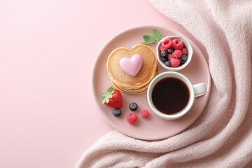 Plate of pancakes with a heart on top and strawberries. Valentines day.