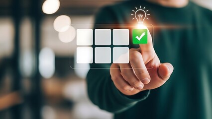 Person touching a digital screen with a green checkmark and light bulb