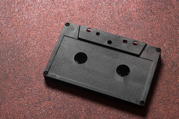 vintage audio cassette tape on brown background close-up