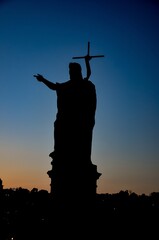 Czech Republic, Prague September 6, 2025 statue of Christ on the Charles Bridge in Prague