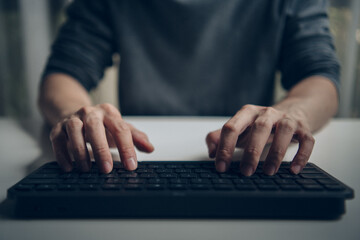 Hands typing on keyboard. Professional freelancer working from home office. Concept of programming, digital marketing, copywriter, content creator, searching information, data and software development