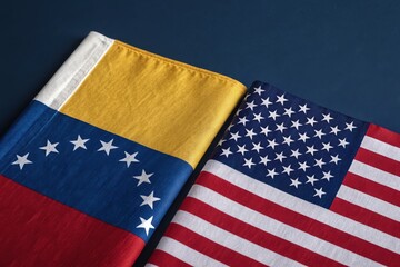 Venezuela flag and US flag side by side symbolize crisis tension and diplomatic relationship between Venezuela and US government