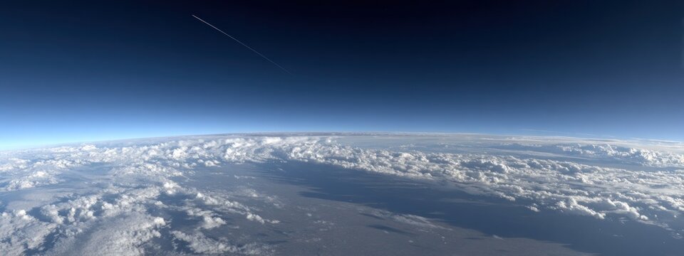 Clear view of clouds and sky from high altitude during a flight