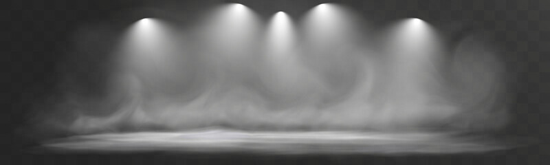 Empty stage with soft fog and five spotlights shining through the smoke, creating a dramatic atmospheric background.
