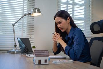 Business professionals are stressed out reviewing accounting records, dealing with debt, bankruptcy, losses from the economic recession, worrying about loans, income, assets, taxes, and frantically 