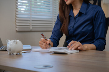 Asian business professionals analyze accounts and documents, calculate budgets, expenses, loans,...