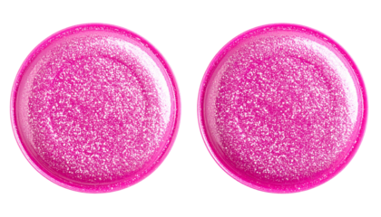 Two close-up, circular, pink, shimmering objects against a black background