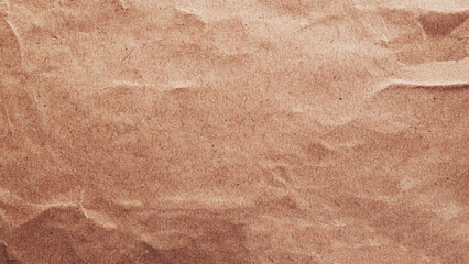 Fototapeta premium Crumpled brown paper texture background. Brown paper board texture