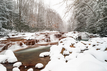 Muddy Creek Falls - Snowy winter scene in Appalachian forest with waterfall - West Virginia