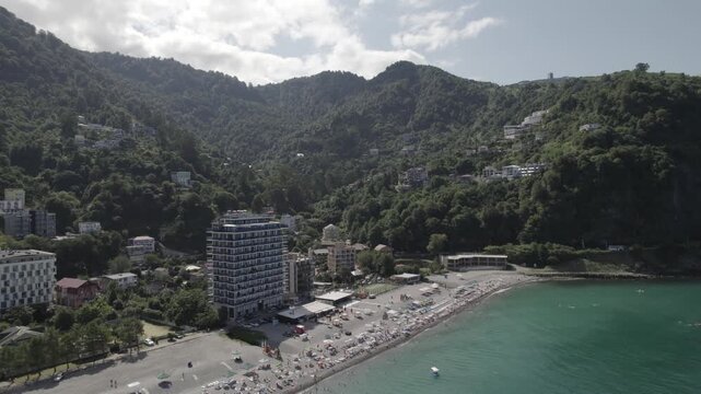 Aerial view of the Kvariati coastline in Adjara, Georgia, featuring seaside resorts, green hills, and the calm Black Sea. Peaceful coastal landscape with hotels, shoreline, and mountain backdrop