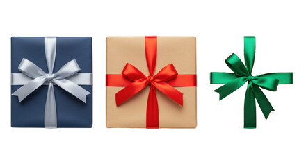 Three uniformly sized gift boxes: navy blue with silver, kraft with red, deep red with emerald green satin ribbons and bows, horizontally on a transparent studio background with copy space,