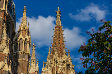 Fototapeta premium Panorama of Maria vom Siege Kirche church in Vienna, Austria, with baroque architecture, domes, and surrounding urban landscape. Historic religious landmark showing European cultural heritage, citysca