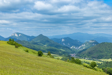 Naklejka premium Green hills and forested mountains with village vista in Velky Lipnik Slovakia