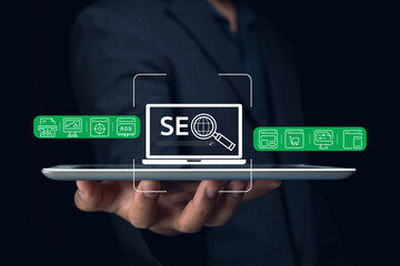 A person holds a tablet displaying SEO tools and analytics, emphasizing the importance of search...