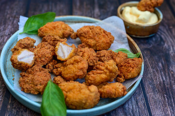 Crispy  deep fried   chicken strips and wedges potato. Breaded  with cornflakes chicken  breast...