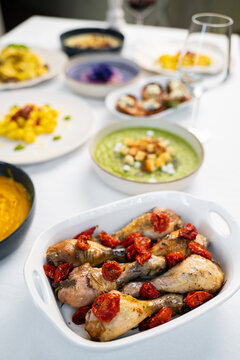 Roasted chicken drumsticks with sun-dried tomatoes, Italian gourmet main course