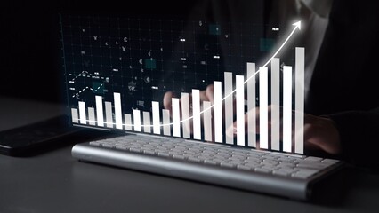 This image highlights a digital growth chart in a dark setting, symbolizing data analysis and financial success, with a keyboard in the foreground, representing modern technology. Copula