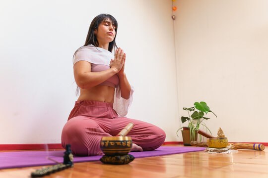Woman practicing yoga in a serene indoor space