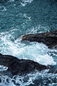 Rugged coastline with crashing waves in Lugo, Spain