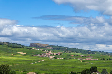Obraz premium Fuisse village and vineyards under clouds, Bourgogne Franche Comte