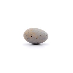 A gray stone with brown and black specks on white surface