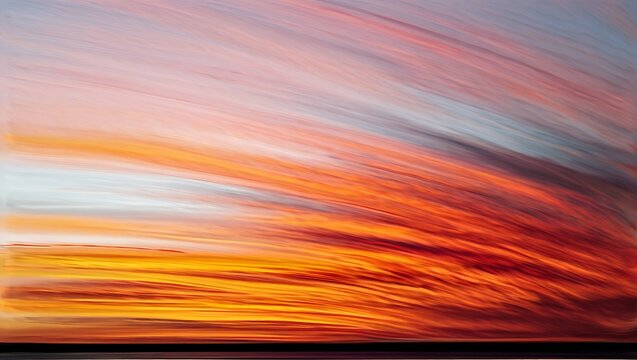 Abstract colorful sunset with streaks of orange and red light in the sky