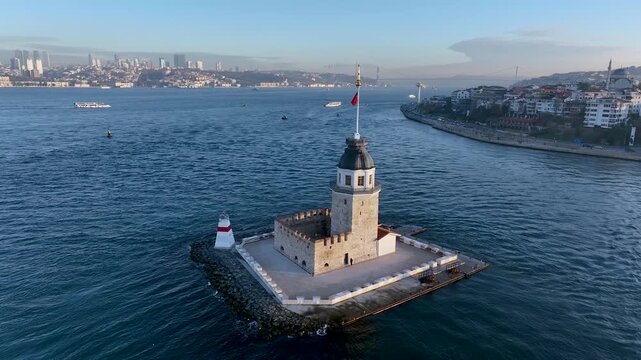 Maiden's Tower. 4k aerial orbit drone view at sunrise in Bosphorus Strait. Shot of the Kiz Kulesi in istanbul, Turkey, situated in the sea at sunset popular tourist destination in the world.