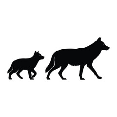 Silhouette of a wolf and its cub walking side-by-side