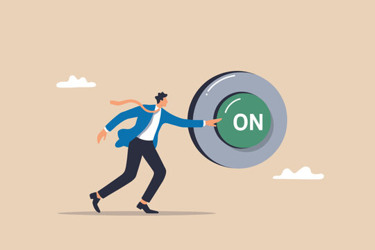 Businessman pushing a giant 'on' button, symbolizing new beginnings and activation