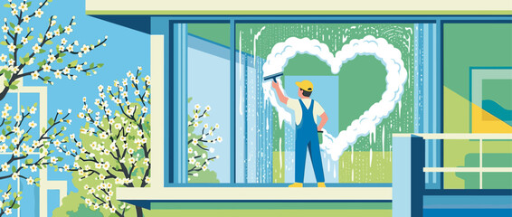 Window cleaner in blue overalls washes a large glass pane, creating a lovely heart shape with soap suds on a sunny spring day with blooming trees outside the home