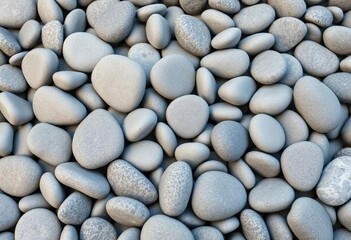 A close-up shot of various smooth grey pebbles forming a natural textured background, highlighting their cool tones and rounded shapes,  scattered,  rock formation
