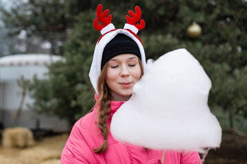 Street winter snack moment with fluffy cotton candy.