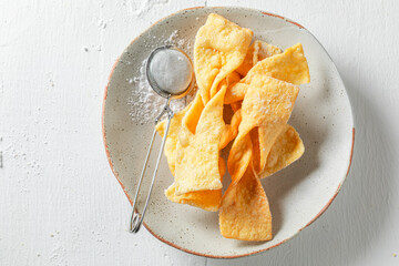 Fresh and yummy angel wings deep fried in oil.