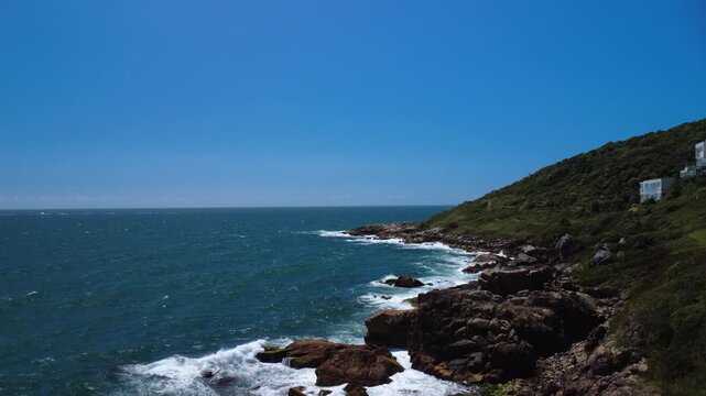 Turquoise Waves Crashing on Rocky Coastline &ndash; Garopaba, Brazil aerial drone shot