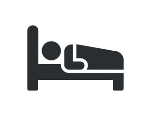 A simplistic black and white graphic depicts a person lying down in a bed symbolizing sleep rest and nighttime relaxation