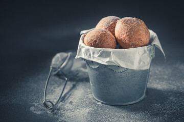 Homemade and fresh mini doughnuts with caster sugar.