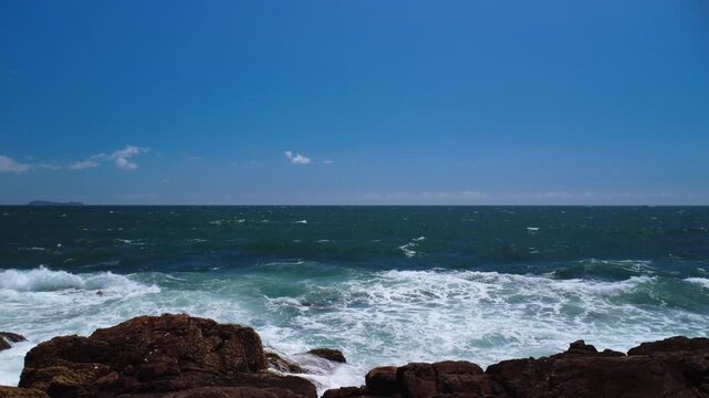 Turquoise Waves Crashing on Rocky Coastline &ndash; Garopaba, Brazil aerial drone shot