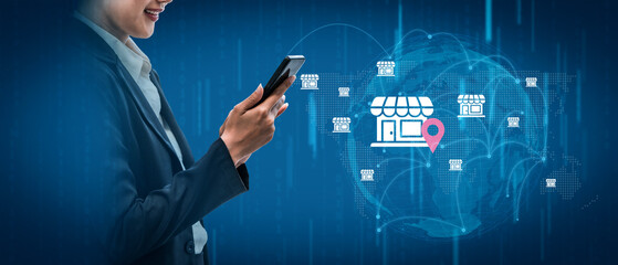 A business professional engages with a smartphone, showcasing a digital map with shop icons, symbolizing modern location-based services and commerce strategies. Gantry