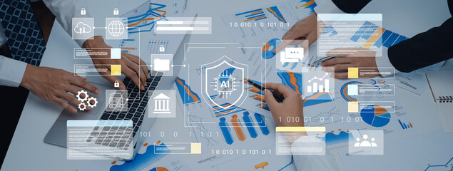 A collaborative workspace showcasing hands analyzing business charts on a laptop, emphasizing digital security and insights for strategic planning and growth. Gantry
